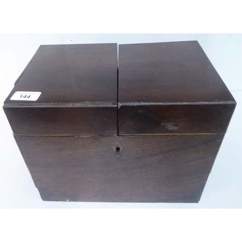 144 - A Georgian mahogany components box tantalus with straight sides and opposing brass bail handles, enc... 