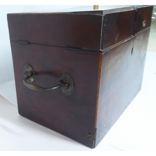 144 - A Georgian mahogany components box tantalus with straight sides and opposing brass bail handles, enc... 
