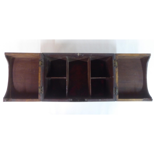 144 - A Georgian mahogany components box tantalus with straight sides and opposing brass bail handles, enc... 