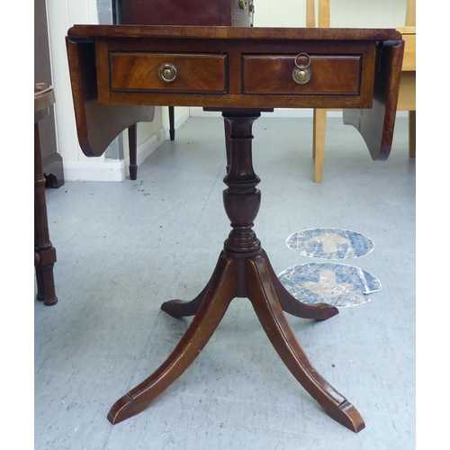 171 - A Victorian style mahogany sofa design table with fall flaps, over a pair of drawers, raised on quad... 