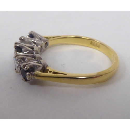 179 - An 18ct bi-coloured gold ring, set with alternating diamonds and sapphires&nbsp;