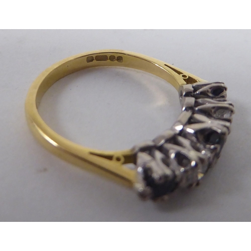 179 - An 18ct bi-coloured gold ring, set with alternating diamonds and sapphires&nbsp;