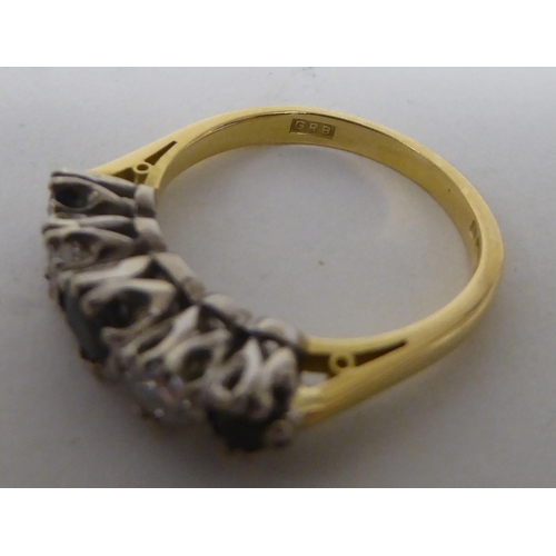 179 - An 18ct bi-coloured gold ring, set with alternating diamonds and sapphires&nbsp;