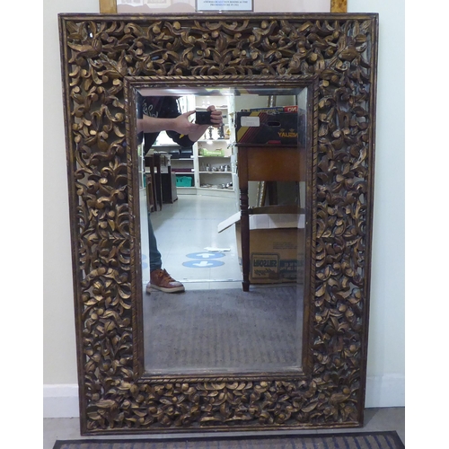 141 - Two modern mirrors, one decorated with birds in flight, set in a gilt frame  22