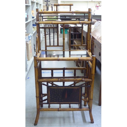 166 - A Victorian style Sino-European bamboo framed stand with shelved superstructure, over a Canterbury b... 