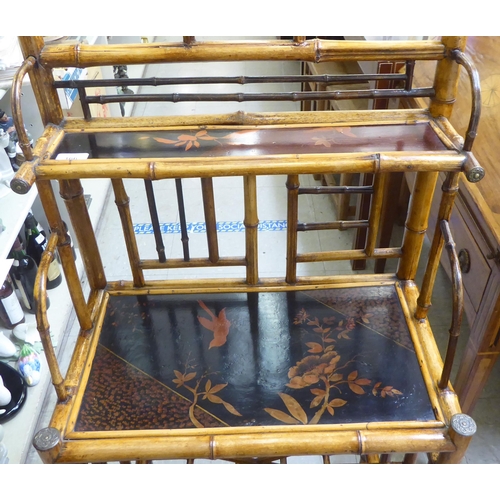 166 - A Victorian style Sino-European bamboo framed stand with shelved superstructure, over a Canterbury b... 