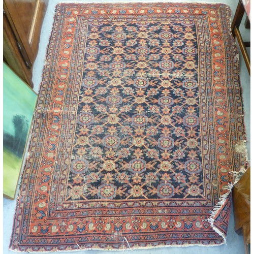 41 - Three rugs: to include a Persian example, on a mustard coloured ground  54