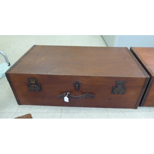 102 - Two vintage hide bound and brown faux hide finished automobile trunks and iron fittings  each 1... 