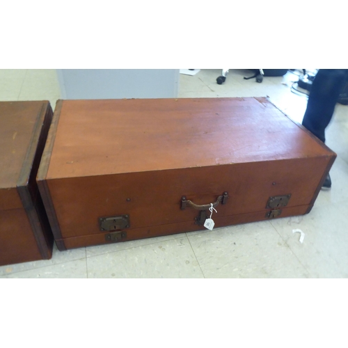 102 - Two vintage hide bound and brown faux hide finished automobile trunks and iron fittings  each 1... 