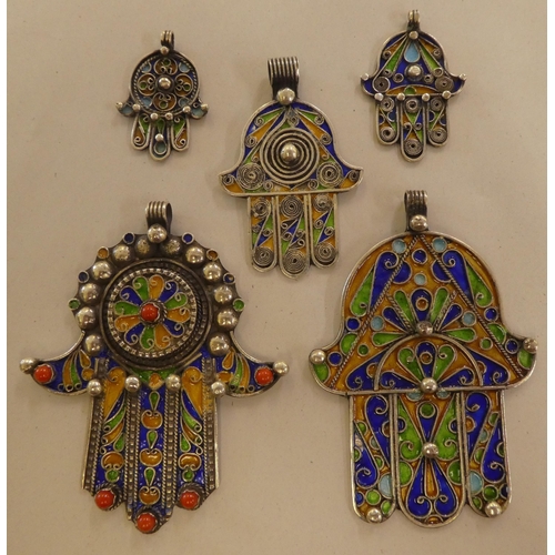 108 - Five Hamsa white metal and multi-coloured enamel pendants