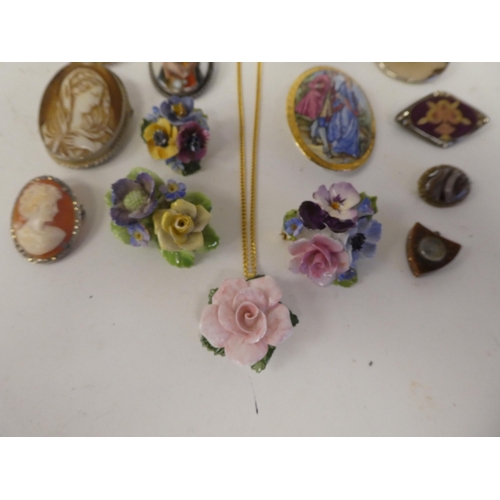 114 - Brooches, mainly porcelain and enamelled: to include cameos