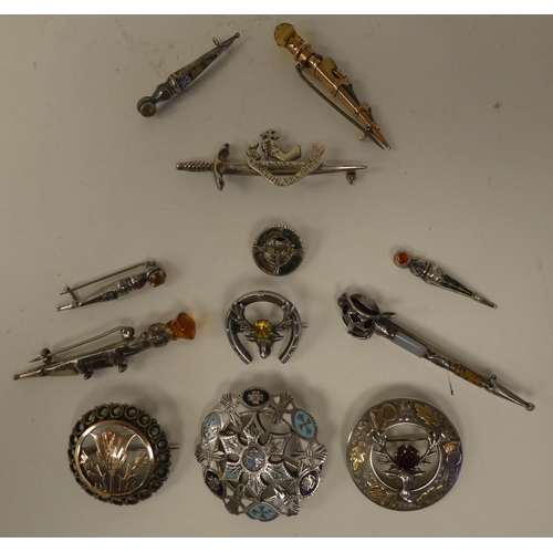 116 - Scottish pin brooches: to include Sterling and other silver and yellow metal sword brooches