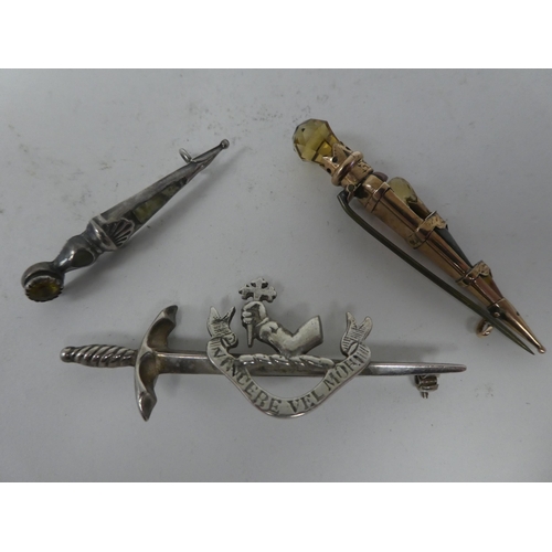 116 - Scottish pin brooches: to include Sterling and other silver and yellow metal sword brooches