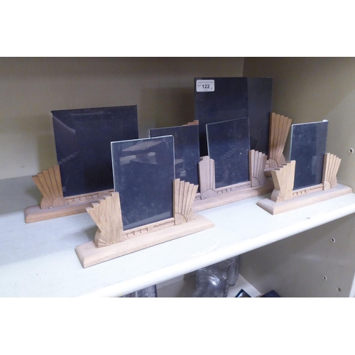 122 - Five similar Art Deco style, carved and framed photograph display stands  largest 8