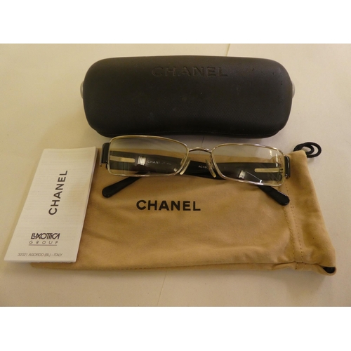 125 - Two pairs of Chanel prescription glasses, viz. a black framed pair  cased with original carton and d... 