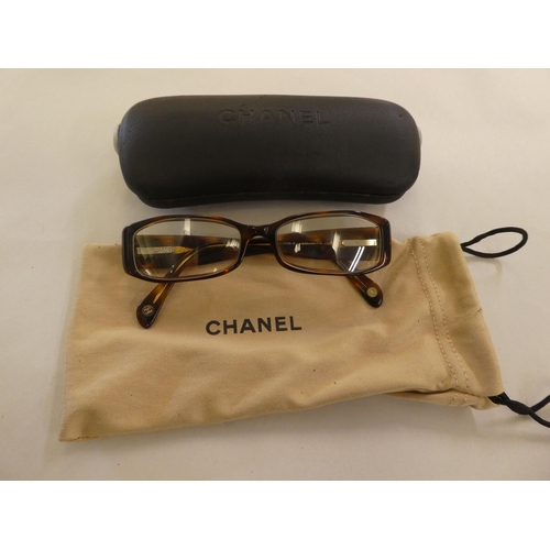 125 - Two pairs of Chanel prescription glasses, viz. a black framed pair  cased with original carton and d... 