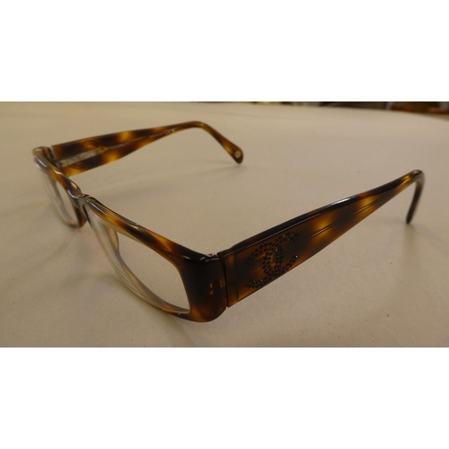 125 - Two pairs of Chanel prescription glasses, viz. a black framed pair  cased with original carton and d... 