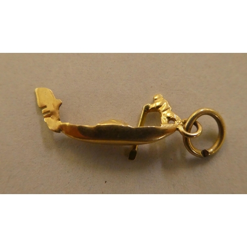 141 - 9ct gold, gold coloured and other metal bracelet charms