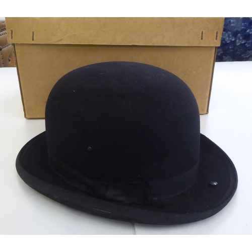 142 - Hats: to include a Gibus folding opera top hat; and other men's fashion accessories