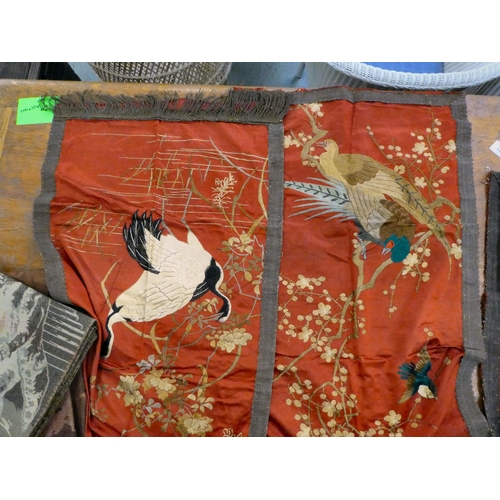 144 - Textiles: to include a set of three early 20thC Chinese embroidered panels, depicting birds  45... 