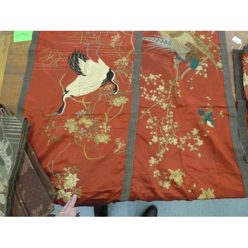 144 - Textiles: to include a set of three early 20thC Chinese embroidered panels, depicting birds  45... 