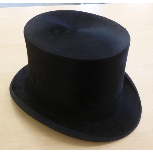 147 - An early 20thC Dunn & Co black silk top hat  21cm front to back  16cm side to side