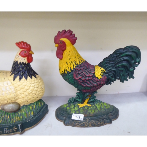 148 - Two cast iron door porters, a chicken  11