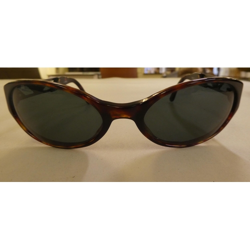 151 - Sunglasses, viz. a pair of Ray-Ban in brown simulated tortoiseshell, in protective cover; and a pair... 