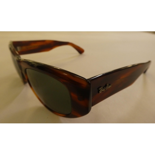 151 - Sunglasses, viz. a pair of Ray-Ban in brown simulated tortoiseshell, in protective cover; and a pair... 