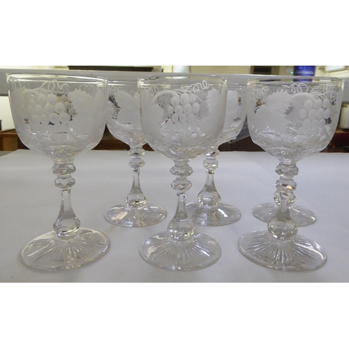 153 - A set of six pedestal wine glasses, engraved with fruiting vine  5.5