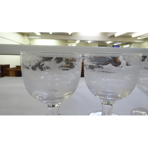 155 - A set of eight pedestal wine glasses, engraved with hunting scenes  5