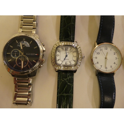 161 - Six modern wristwatches: to include a Tommy Hilfiger stainless steel cased bracelet watch, faced by ... 