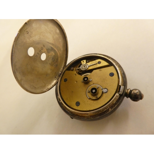 163 - Watches: to include an early 20thC silver cased example, the movement faced by an enamelled Roman di... 