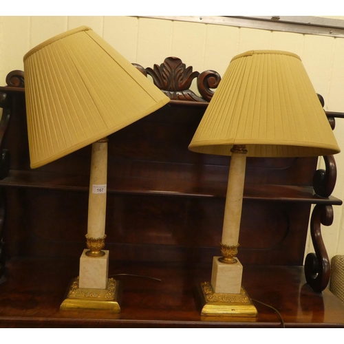 167 - A pair of gilt metal and onyx table lamps with Corinthian columns, on a plinth  18