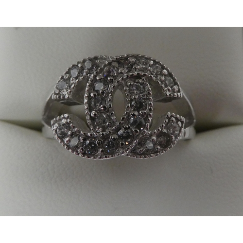 17 - A silver coloured metal cubic zirconia set dress ring