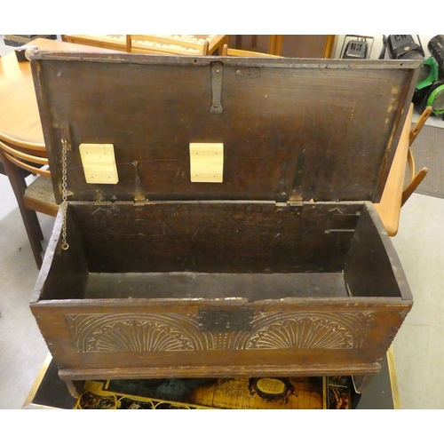 175 - A mid 18thC oak bordered coffer with a hinged lid, raised on bracket feet  18