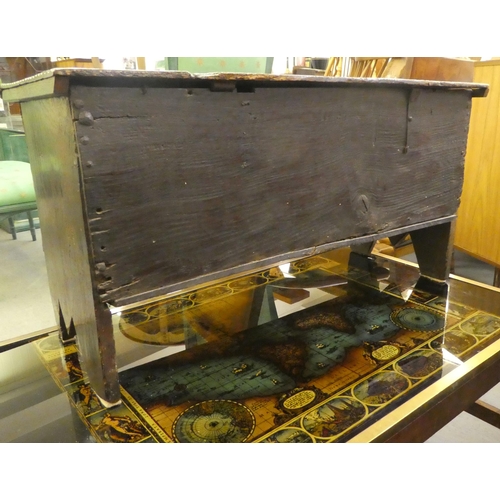 175 - A mid 18thC oak bordered coffer with a hinged lid, raised on bracket feet  18