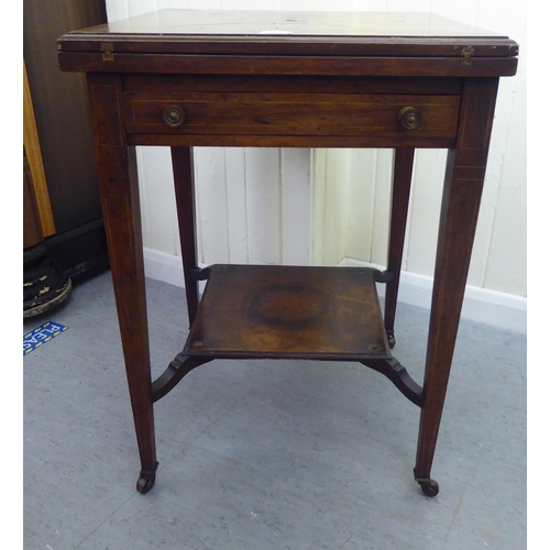 180 - An Edwardian marquetry inlaid rosewood envelope card table with a frieze drawer, raised on square, t... 