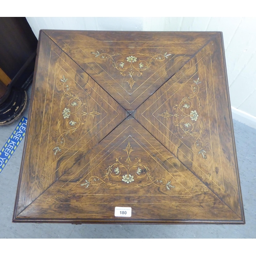 180 - An Edwardian marquetry inlaid rosewood envelope card table with a frieze drawer, raised on square, t... 