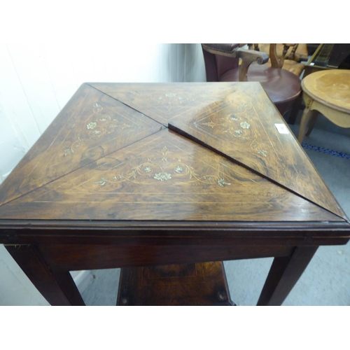 180 - An Edwardian marquetry inlaid rosewood envelope card table with a frieze drawer, raised on square, t... 