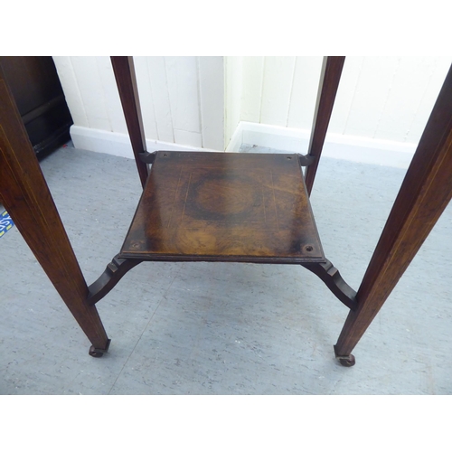 180 - An Edwardian marquetry inlaid rosewood envelope card table with a frieze drawer, raised on square, t... 