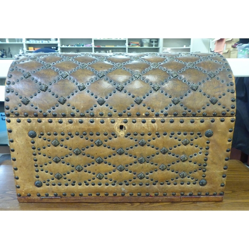188 - A modern brown faux hide stud upholstered dome top trunk with a hinged lid&nbsp; 15