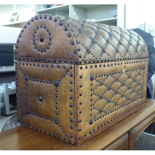 188 - A modern brown faux hide stud upholstered dome top trunk with a hinged lid&nbsp; 15