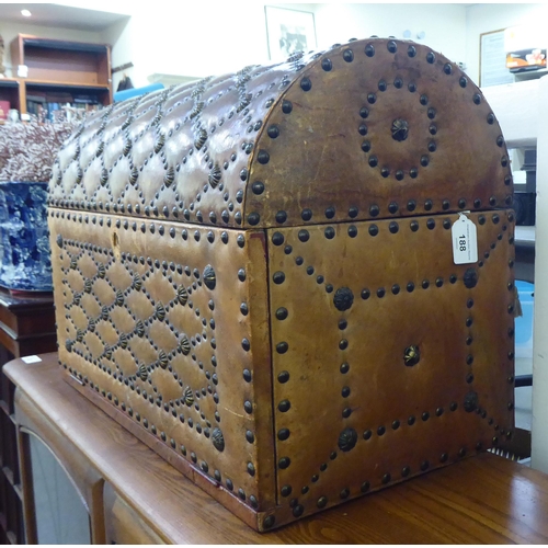 188 - A modern brown faux hide stud upholstered dome top trunk with a hinged lid&nbsp; 15
