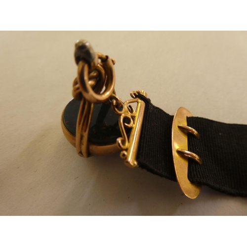 191 - A late Victorian 9ct gold and black fabric seal fob and strap&nbsp;