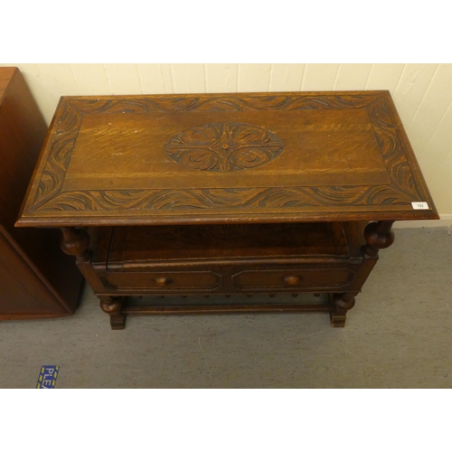 192 - A 1930s oak monks bench with a carved lift and slide back, over a hinged seat, raised on splayed fee... 