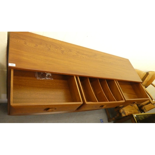 193 - An Ercol mid brown elm sideboard with three drawers and three doors, on a plinth&nbsp; 37