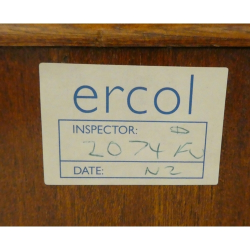 193 - An Ercol mid brown elm sideboard with three drawers and three doors, on a plinth&nbsp; 37