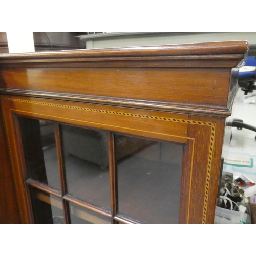 195 - An Edwardian mahogany breakfront bookcase with four astragal glazed doors, raised on bracket feet&nb... 