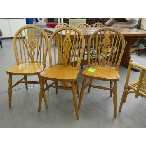 196 - A modern pine refectory design kitchen table, raised on plank ends  30